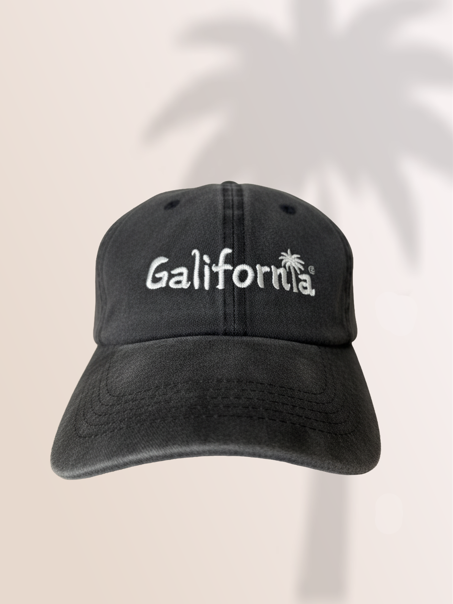 Distressed cotton baseball cap in slate gray with "Galifornia" embroidered across the front and an adjustable back.